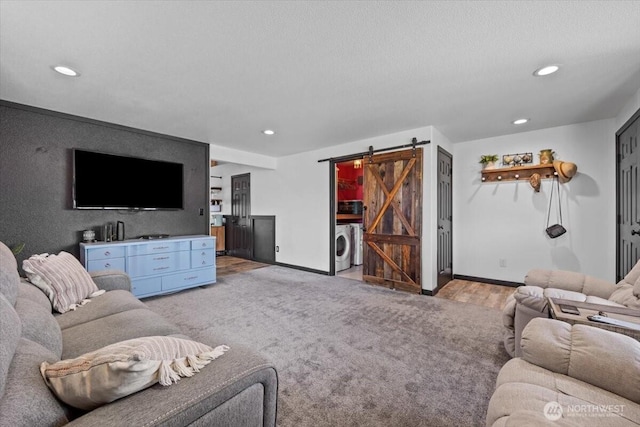 8308 Langara Dr, Pasco, WA 99301 - living area featuring a barn door, recessed lighting, and washer / clothes dryer