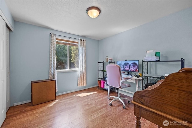 8308 Langara Dr, Pasco, WA 99301 - office space with wood finished floors and a textured ceiling