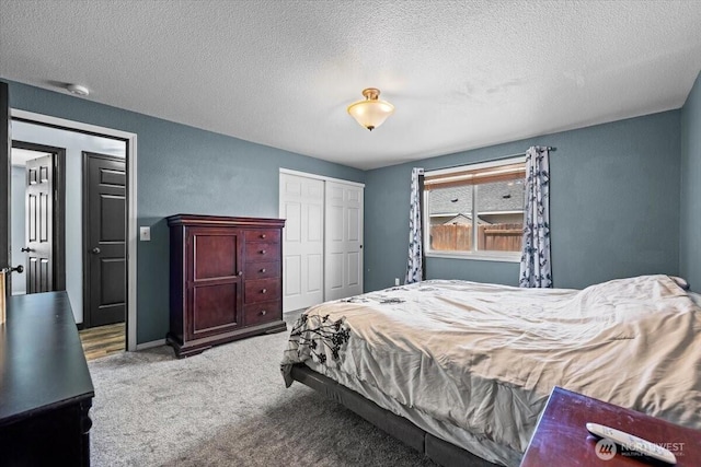 8308 Langara Dr, Pasco, WA 99301 - carpeted bedroom featuring a closet and a textured ceiling