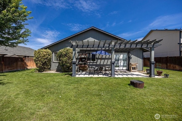 8308 Langara Dr, Pasco, WA 99301 - rear view of house with a pergola, a fenced backyard, a patio area, and french doors