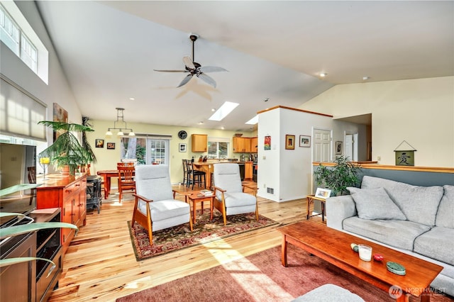 4243 Holcomb St, Port Townsend, WA 98368 - living area with light wood finished floors, lofted ceiling, ceiling fan, a skylight, and recessed lighting