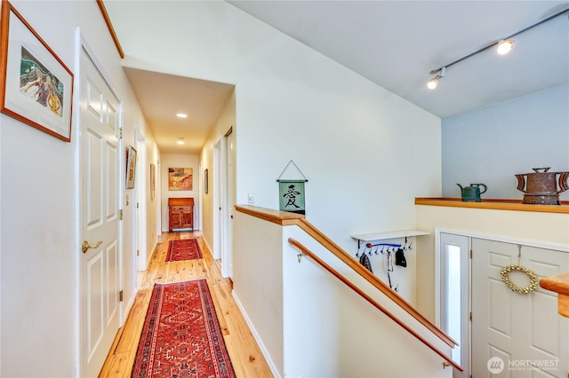 4243 Holcomb St, Port Townsend, WA 98368 - hall with light wood finished floors, track lighting, and recessed lighting