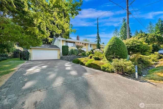 507 Lyla Ln, Bellingham, WA 98225 - view of front of home featuring driveway, a chimney, and an attached garage