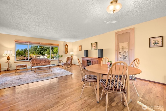 507 Lyla Ln, Bellingham, WA 98225 - dining room featuring a textured ceiling and light wood-type flooring