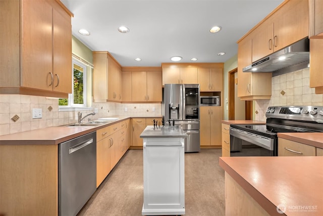 507 Lyla Ln, Bellingham, WA 98225 - kitchen with stainless steel appliances, under cabinet range hood, light brown cabinets, tasteful backsplash, and recessed lighting