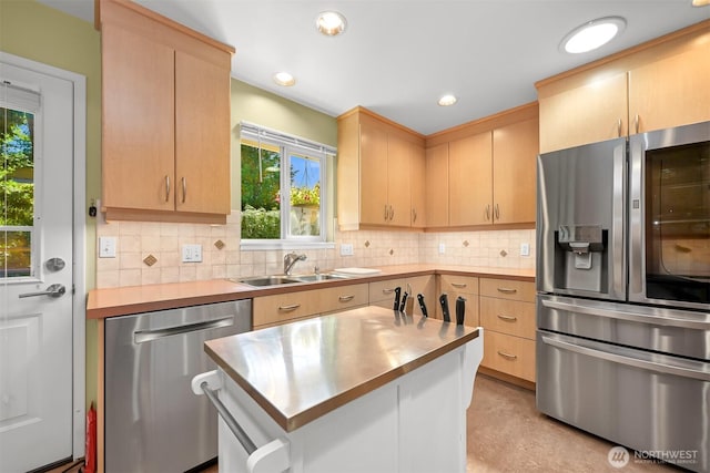 507 Lyla Ln, Bellingham, WA 98225 - kitchen featuring appliances with stainless steel finishes, light brown cabinetry, healthy amount of natural light, decorative backsplash, and recessed lighting