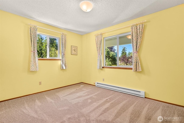 507 Lyla Ln, Bellingham, WA 98225 - carpeted spare room featuring a baseboard radiator and a textured ceiling