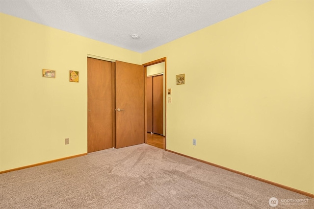 507 Lyla Ln, Bellingham, WA 98225 - unfurnished room featuring carpet, a textured ceiling, and a smoke detector