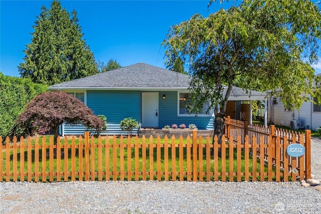 10812 2nd Ave S, Seattle, WA 98168 - view of front of house with a fenced front yard and a shingled roof
