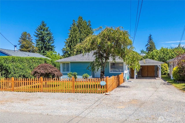 10812 2nd Ave S, Seattle, WA 98168 - view of front facade with a fenced front yard, dirt driveway, and a carport