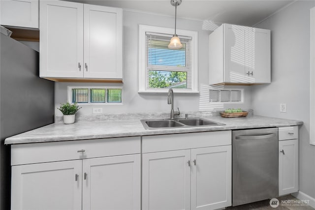 10812 2nd Ave S, Seattle, WA 98168 - kitchen featuring dishwasher, light countertops, white cabinets, hanging light fixtures, and ornamental molding