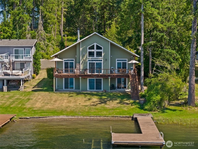 1321 E Mason Lake Dr E, Grapeview, WA 98546 - rear view of property with stairway, a yard, and a deck with water view