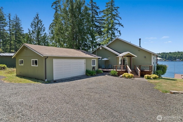 1321 E Mason Lake Dr E, Grapeview, WA 98546 - view of front of property with an outbuilding, a deck, and a detached garage