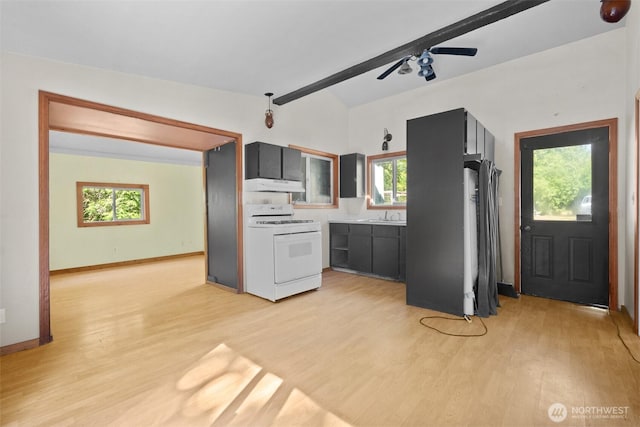 9330 Odell St, Blaine, WA 98230 - kitchen with white gas range oven, under cabinet range hood, light wood-type flooring, and healthy amount of natural light