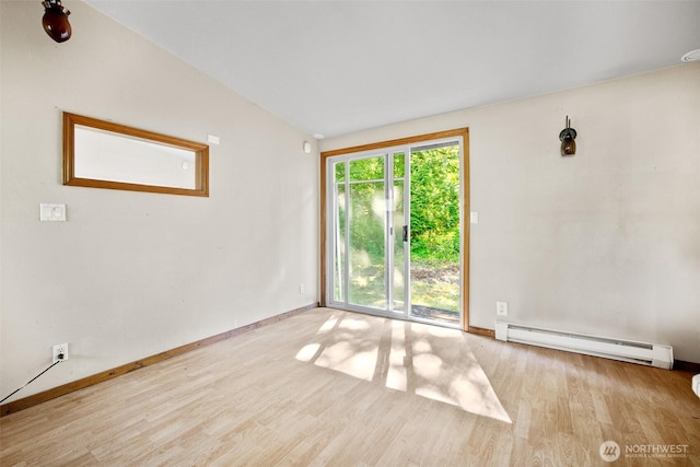 9330 Odell St, Blaine, WA 98230 - unfurnished room featuring baseboard heating and wood finished floors