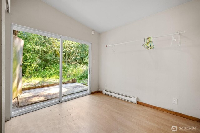 9330 Odell St, Blaine, WA 98230 - spare room with baseboard heating and wood finished floors