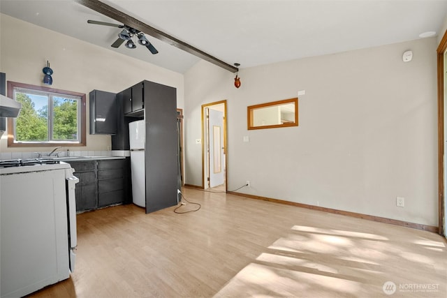 9330 Odell St, Blaine, WA 98230 - kitchen with freestanding refrigerator, white gas stove, light wood finished floors, and ceiling fan