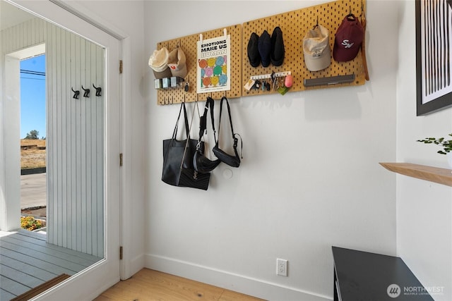 600 SW Cloverdale St, Seattle, WA 98106 - mudroom featuring plenty of natural light and wood finished floors