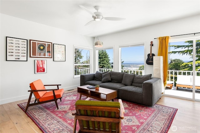600 SW Cloverdale St, Seattle, WA 98106 - living area featuring a ceiling fan and light wood-type flooring