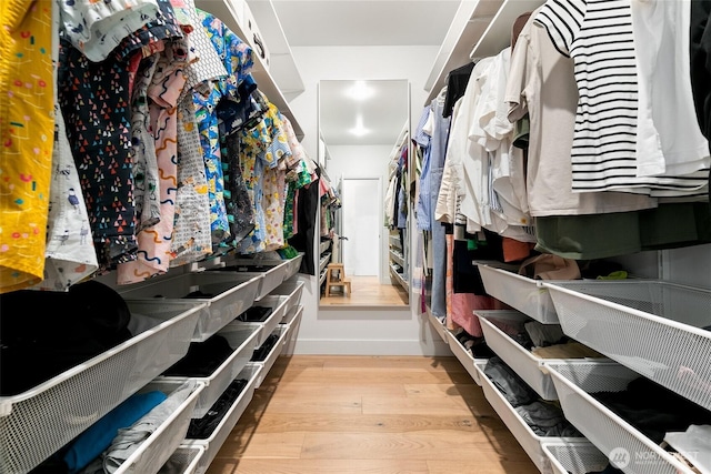 600 SW Cloverdale St, Seattle, WA 98106 - walk in closet featuring wood finished floors