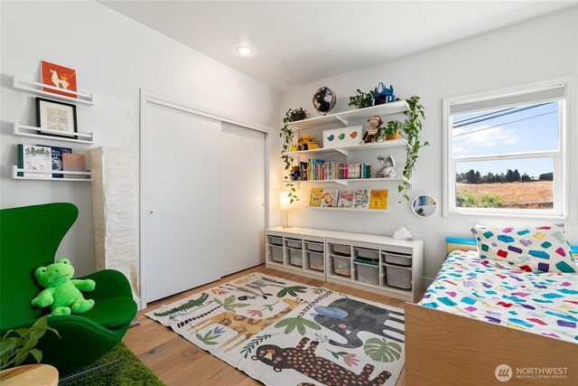 600 SW Cloverdale St, Seattle, WA 98106 - bedroom with wood finished floors and a closet