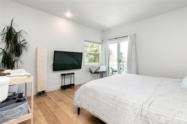 600 SW Cloverdale St, Seattle, WA 98106 - bedroom featuring wood finished floors and recessed lighting
