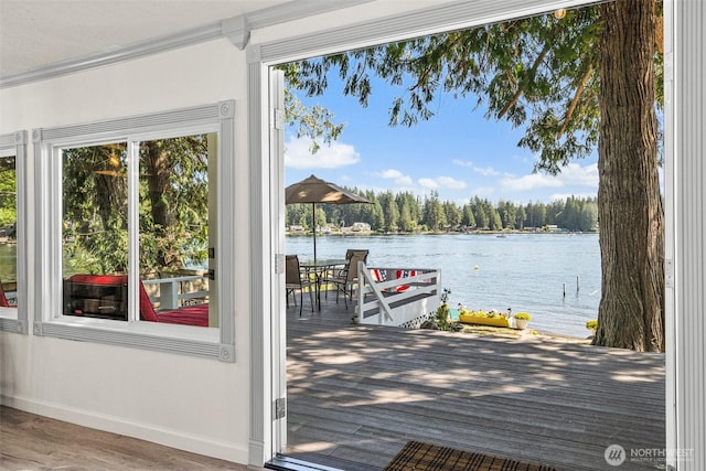 20 E Shore Ct, Grapeview, WA 98546 - doorway to outside with a water view, ornamental molding, and wood finished floors