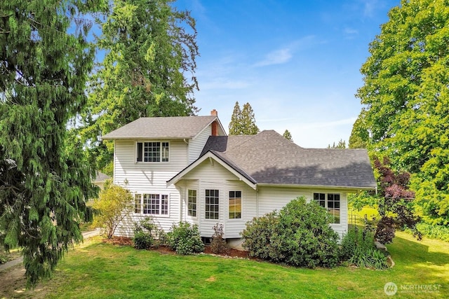 8597 Harborview Rd, Blaine, WA 98230 - back of house with a lawn, a chimney, and a shingled roof