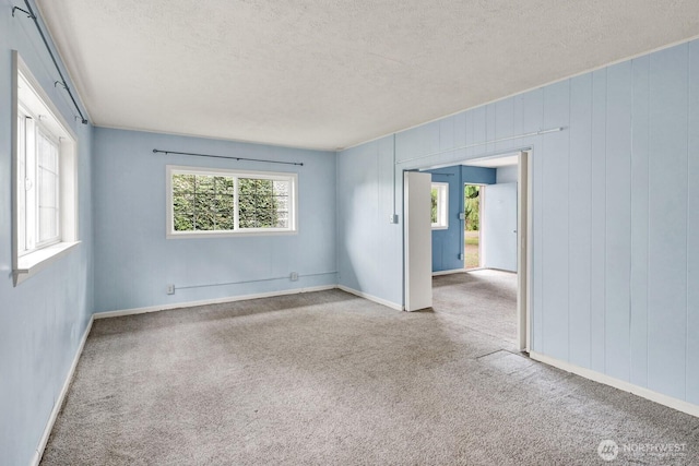 8597 Harborview Rd, Blaine, WA 98230 - spare room featuring a textured ceiling and carpet flooring