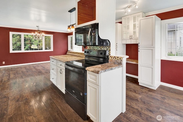 8597 Harborview Rd, Blaine, WA 98230 - kitchen with black appliances, dark wood-style flooring, a chandelier, white cabinets, and backsplash
