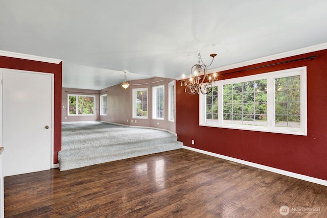8597 Harborview Rd, Blaine, WA 98230 - unfurnished room with wood finished floors, a chandelier, and ornamental molding