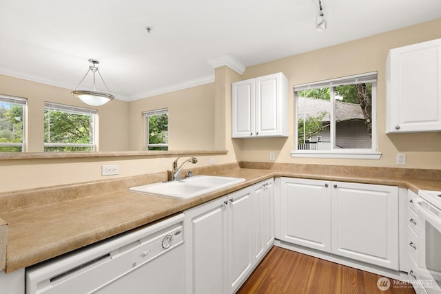 33020 10th Ave SW Unit 301, Federal Way, WA 98023 - kitchen with white dishwasher, white cabinets, light countertops, wood finished floors, and crown molding