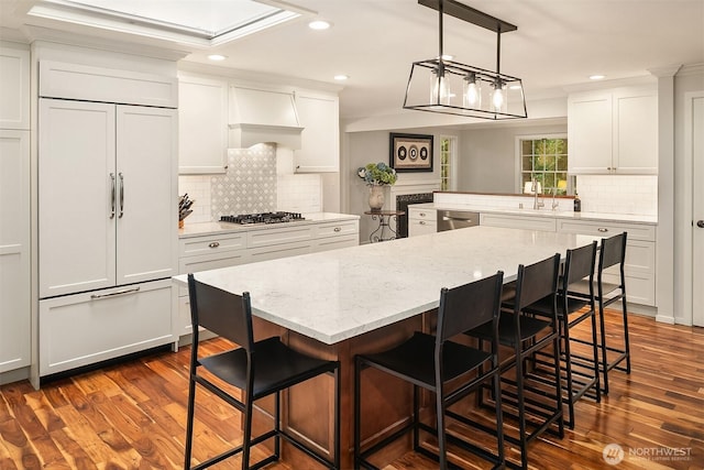 12810 NE 32nd Pl, Bellevue, WA 98005 - kitchen featuring stainless steel appliances, backsplash, white cabinetry, dark wood-style flooring, and recessed lighting