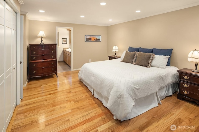 12810 NE 32nd Pl, Bellevue, WA 98005 - bedroom featuring ornamental molding, light wood finished floors, recessed lighting, a closet, and ensuite bathroom