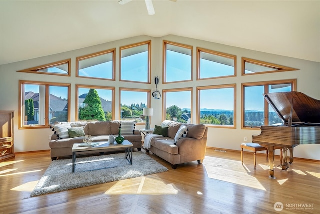 8705 Fenwick Loop SE, Olympia, WA 98513 - living room featuring vaulted ceiling, wood finished floors, and a ceiling fan