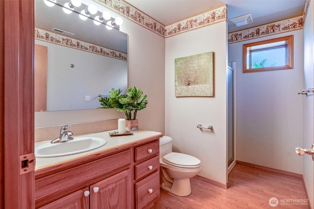 8705 Fenwick Loop SE, Olympia, WA 98513 - bathroom featuring vanity, wood finished floors, and a shower with door