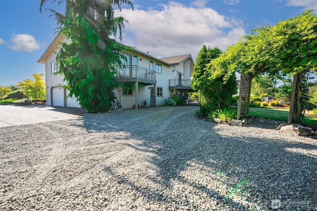 8705 Fenwick Loop SE, Olympia, WA 98513 - view of home's exterior with driveway and an attached garage