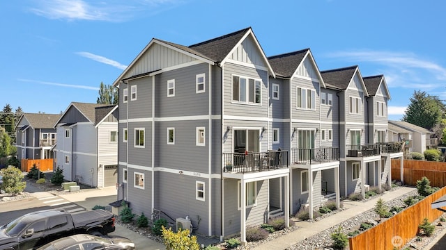 5690 Sunstone Pl Unit 101, Ferndale, WA 98248 - view of side of home with a residential view, board and batten siding, and a shingled roof