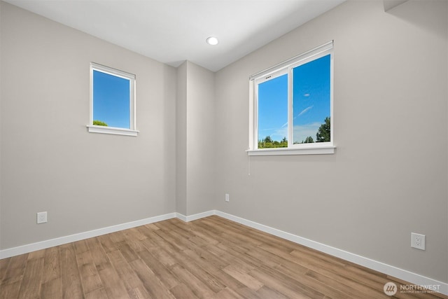 5690 Sunstone Pl Unit 101, Ferndale, WA 98248 - empty room with wood finished floors, plenty of natural light, and recessed lighting