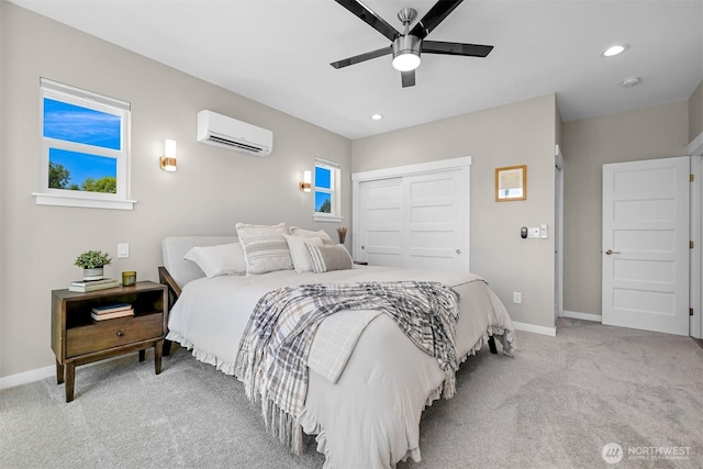 5690 Sunstone Pl Unit 101, Ferndale, WA 98248 - bedroom featuring a wall mounted AC, light colored carpet, a closet, recessed lighting, and ceiling fan