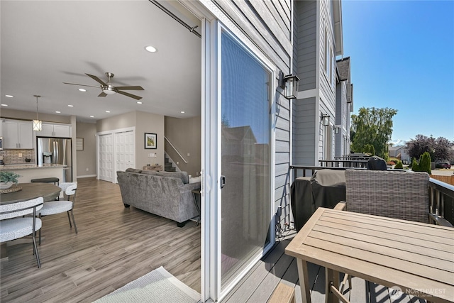 5690 Sunstone Pl Unit 101, Ferndale, WA 98248 - balcony with ceiling fan and outdoor dining area
