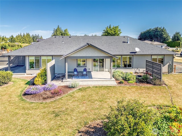 73 Sable Ct, Sequim, WA 98382 - back of property with a lawn and a shingled roof
