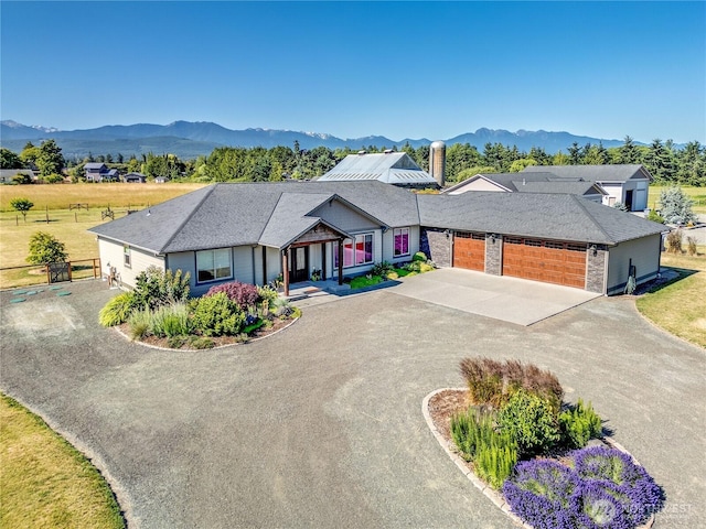 73 Sable Ct, Sequim, WA 98382 - view of front of house featuring concrete driveway, a garage, and a mountain view