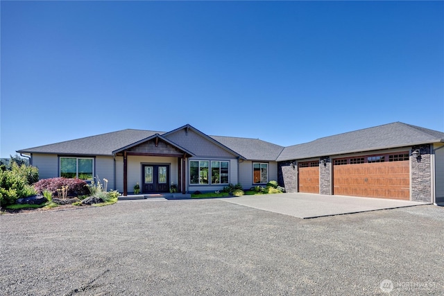 73 Sable Ct, Sequim, WA 98382 - view of front of property with concrete driveway, a garage, and french doors