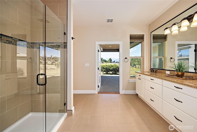 73 Sable Ct, Sequim, WA 98382 - full bathroom featuring vanity, a stall shower, and tile patterned flooring
