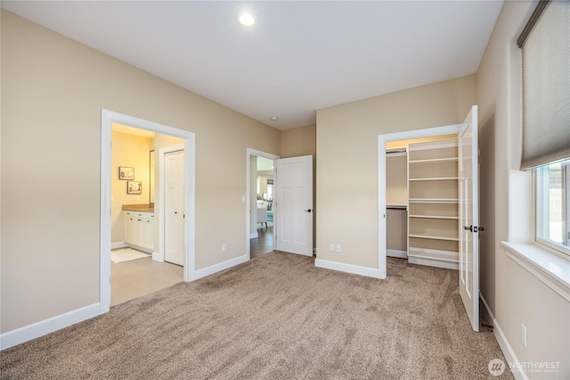 73 Sable Ct, Sequim, WA 98382 - unfurnished bedroom featuring light colored carpet, a walk in closet, a closet, and ensuite bath