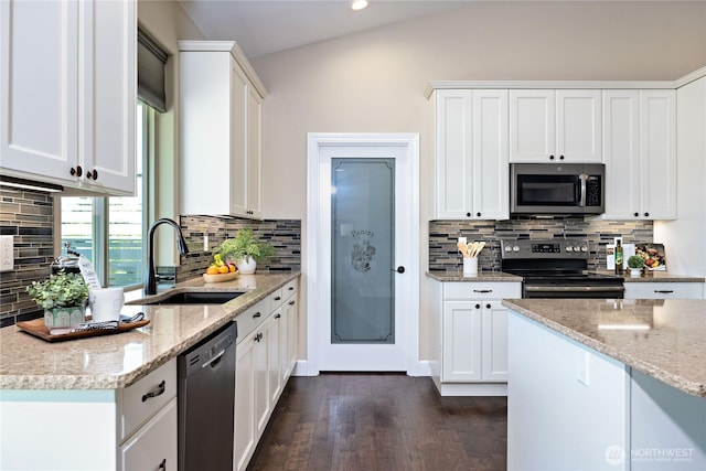 73 Sable Ct, Sequim, WA 98382 - kitchen featuring appliances with stainless steel finishes, dark wood finished floors, backsplash, light stone counters, and white cabinetry