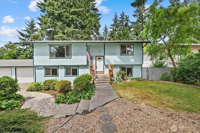 14416 4th Ave E, Tacoma, WA 98445 - split foyer home featuring an attached garage and driveway