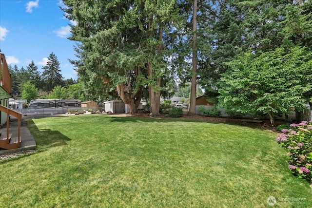 14416 4th Ave E, Tacoma, WA 98445 - fenced backyard featuring a storage unit