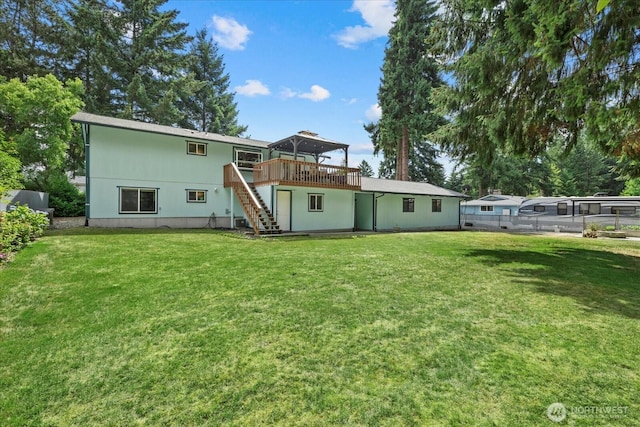 14416 4th Ave E, Tacoma, WA 98445 - rear view of house with stairway and a wooden deck